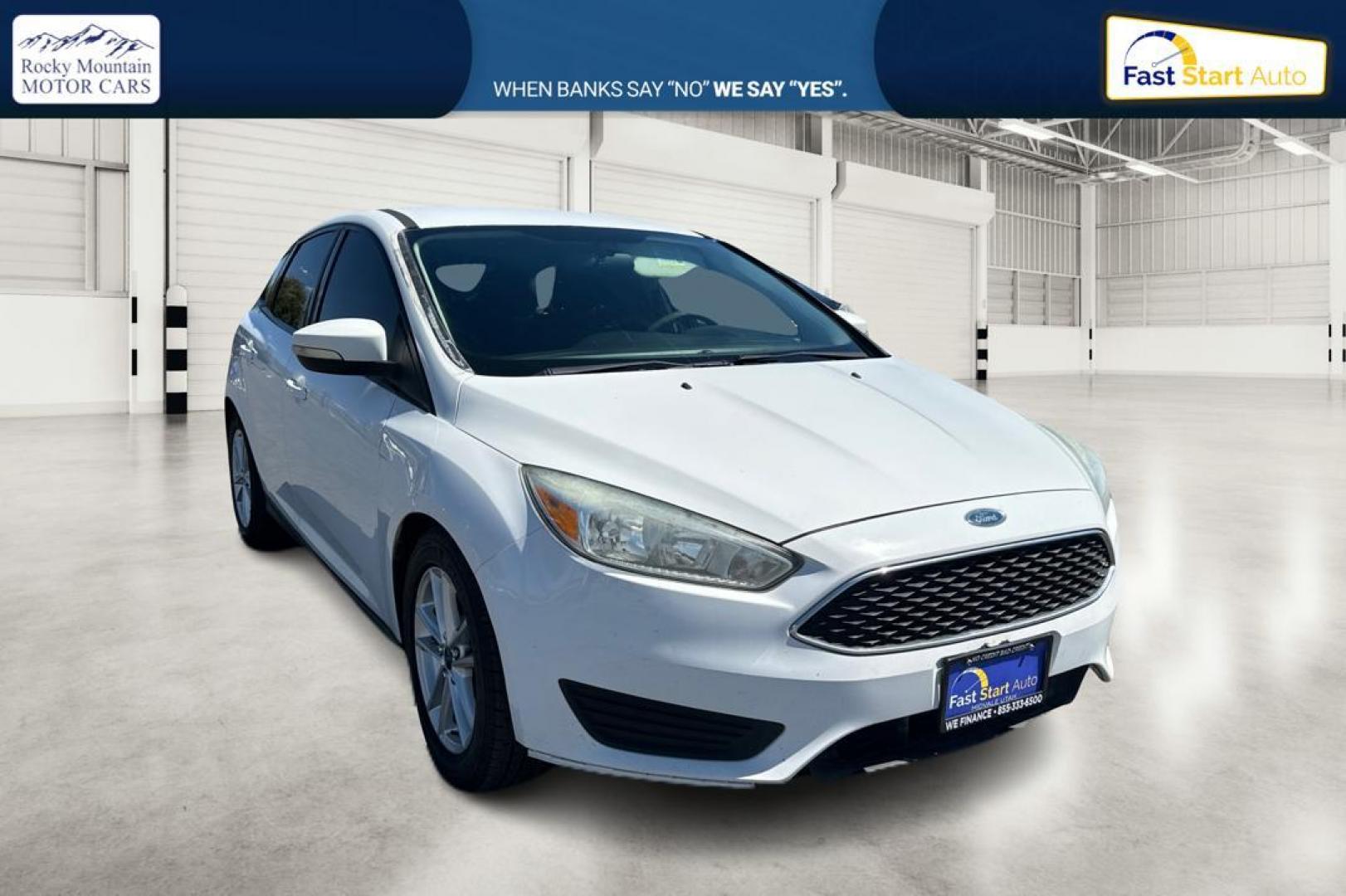 2015 White Ford Focus SE Hatch (1FADP3K23FL) with an 2.0L L4 DOHC 16V engine, 5-Speed Manual transmission, located at 7755 State Street, Midvale, UT, 84047, (801) 753-9063, 40.610329, -111.890656 - Photo#0