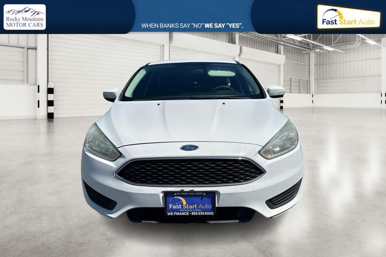2015 White Ford Focus SE Hatch (1FADP3K23FL) with an 2.0L L4 DOHC 16V engine, 5-Speed Manual transmission, located at 7755 State Street, Midvale, UT, 84047, (801) 753-9063, 40.610329, -111.890656 - Photo#7