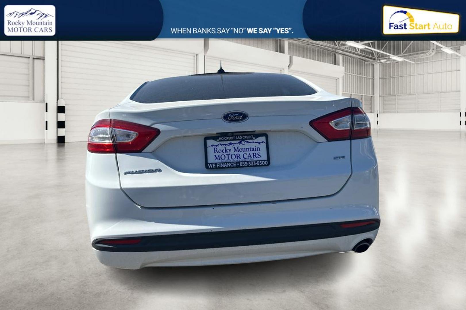 2015 White Ford Fusion SE (3FA6P0H71FR) with an 2.5L L4 DOHC 16V engine, Auto, 6-Spd w/SelShft transmission, located at 7755 State Street, Midvale, UT, 84047, (801) 753-9063, 40.610329, -111.890656 - Photo#4