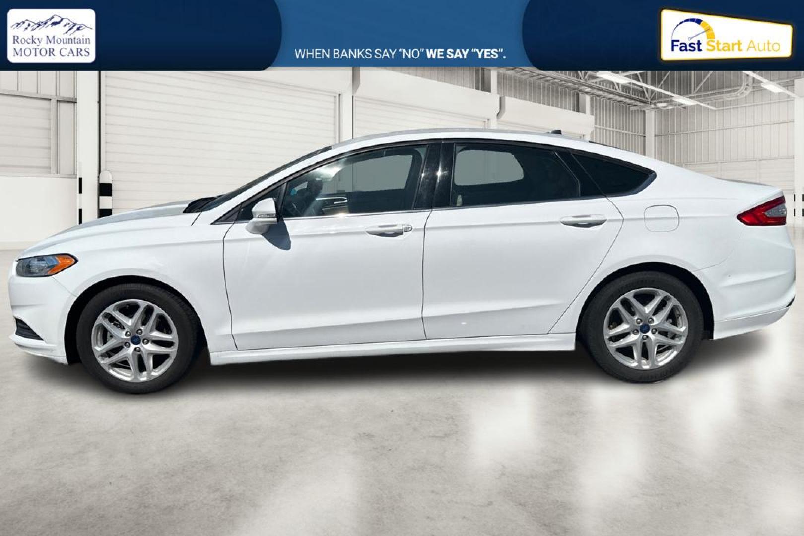 2015 White Ford Fusion SE (3FA6P0H71FR) with an 2.5L L4 DOHC 16V engine, Auto, 6-Spd w/SelShft transmission, located at 7755 State Street, Midvale, UT, 84047, (801) 753-9063, 40.610329, -111.890656 - Photo#6