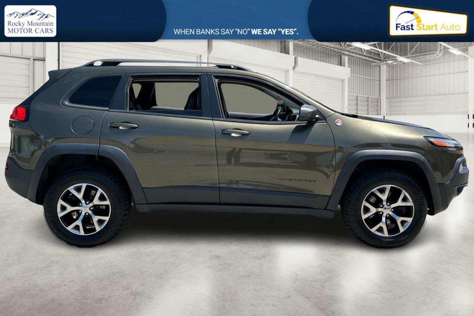 2015 Green Jeep Cherokee Trailhawk 4WD (1C4PJMBSXFW) with an 3.2L V6 DOHC 24V engine, 9-Speed Automatic transmission, located at 767 S State Road, Pleasant Grove, UT, 84062, (801) 785-1058, 40.354839, -111.736687 - Photo#1