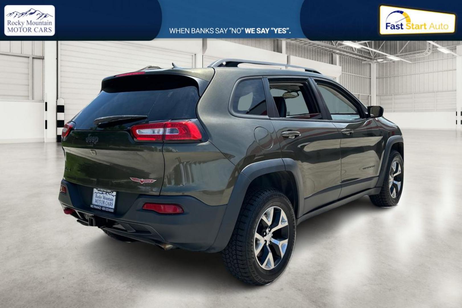 2015 Green Jeep Cherokee Trailhawk 4WD (1C4PJMBSXFW) with an 3.2L V6 DOHC 24V engine, 9-Speed Automatic transmission, located at 767 S State Road, Pleasant Grove, UT, 84062, (801) 785-1058, 40.354839, -111.736687 - Photo#2