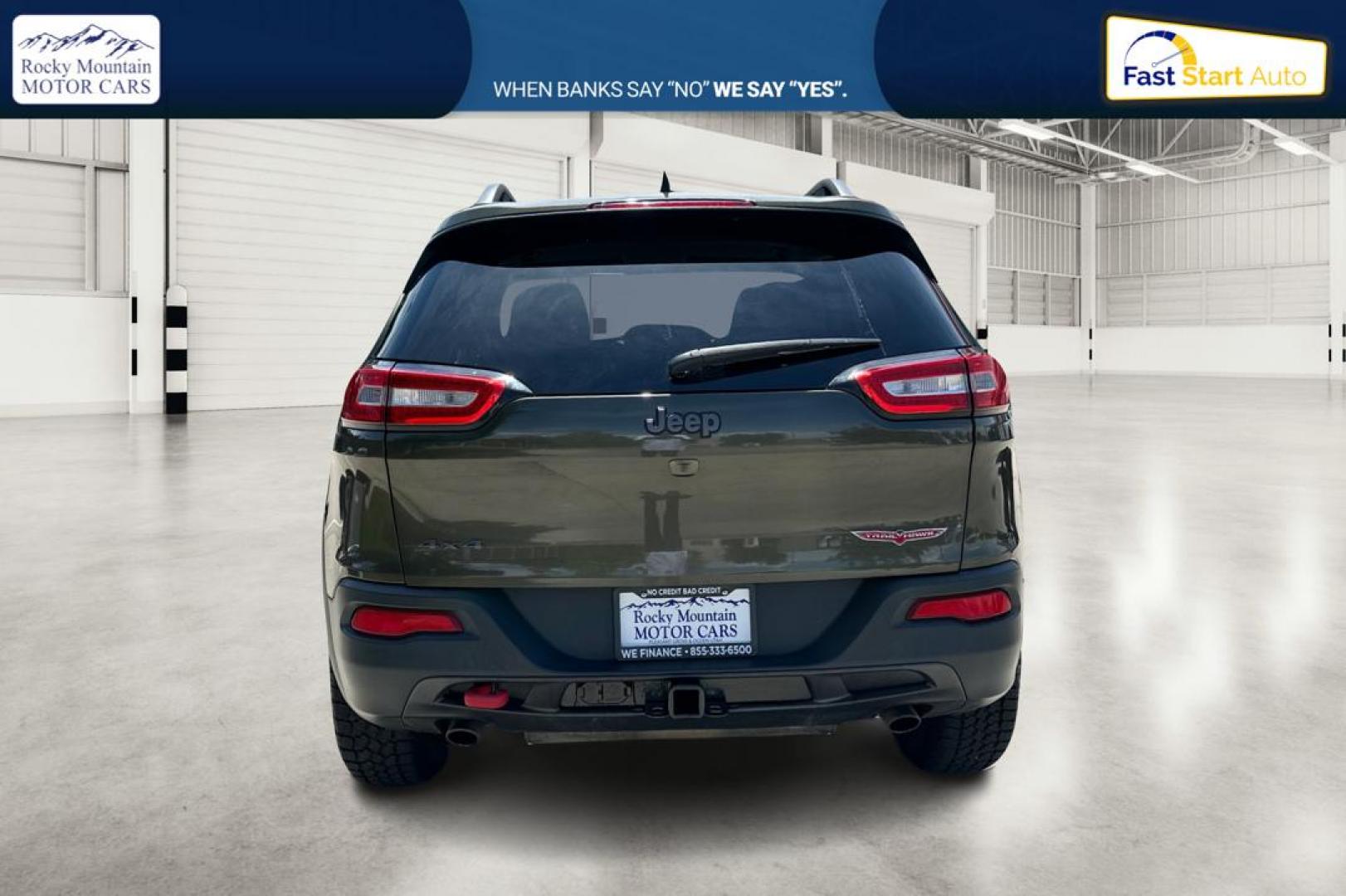 2015 Green Jeep Cherokee Trailhawk 4WD (1C4PJMBSXFW) with an 3.2L V6 DOHC 24V engine, 9-Speed Automatic transmission, located at 767 S State Road, Pleasant Grove, UT, 84062, (801) 785-1058, 40.354839, -111.736687 - Photo#4