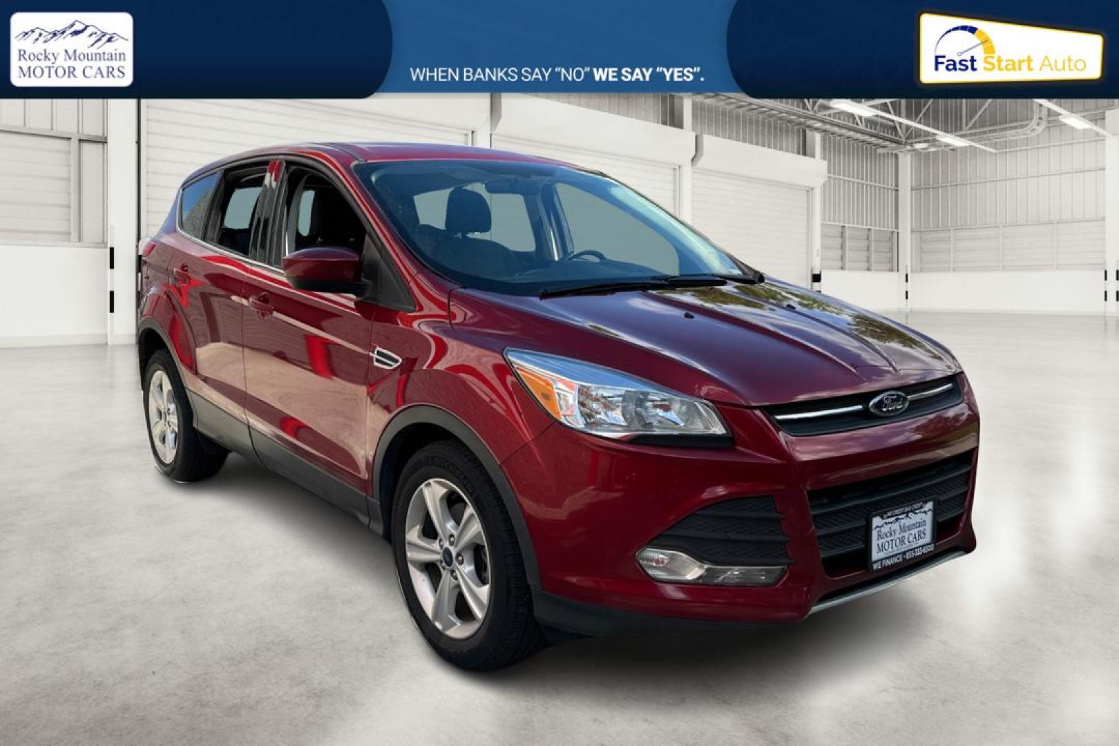 2016 Red Ford Escape SE FWD (1FMCU0G79GU) with an 2.5L L4 DOHC 16V engine, 6-Speed Automatic transmission, located at 767 S State Road, Pleasant Grove, UT, 84062, (801) 785-1058, 40.354839, -111.736687 - Photo#0