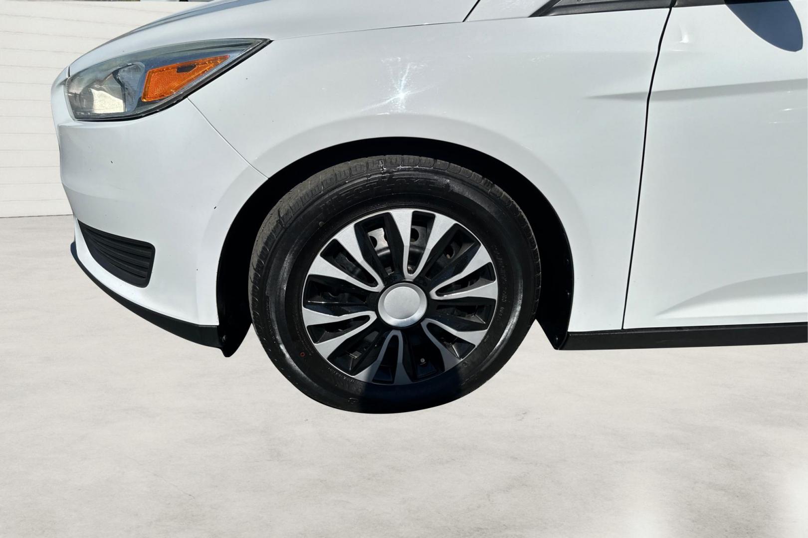 2016 White Ford Focus S Sedan (1FADP3E26GL) with an 2.0L L4 DOHC 16V engine, 5M transmission, located at 7755 State Street, Midvale, UT, 84047, (801) 753-9063, 40.610329, -111.890656 - Photo#9