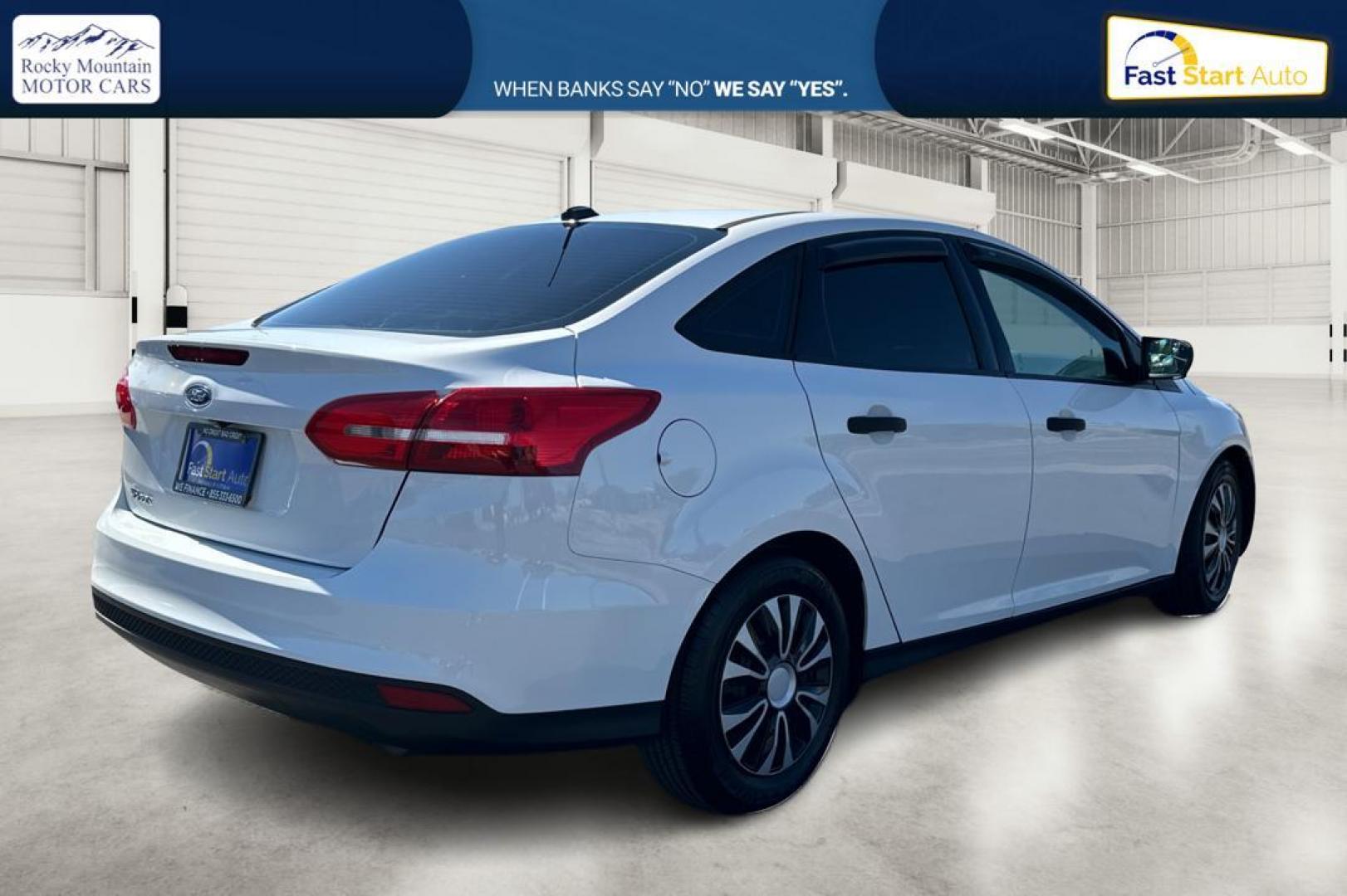 2016 White Ford Focus S Sedan (1FADP3E26GL) with an 2.0L L4 DOHC 16V engine, 5M transmission, located at 7755 State Street, Midvale, UT, 84047, (801) 753-9063, 40.610329, -111.890656 - Photo#2