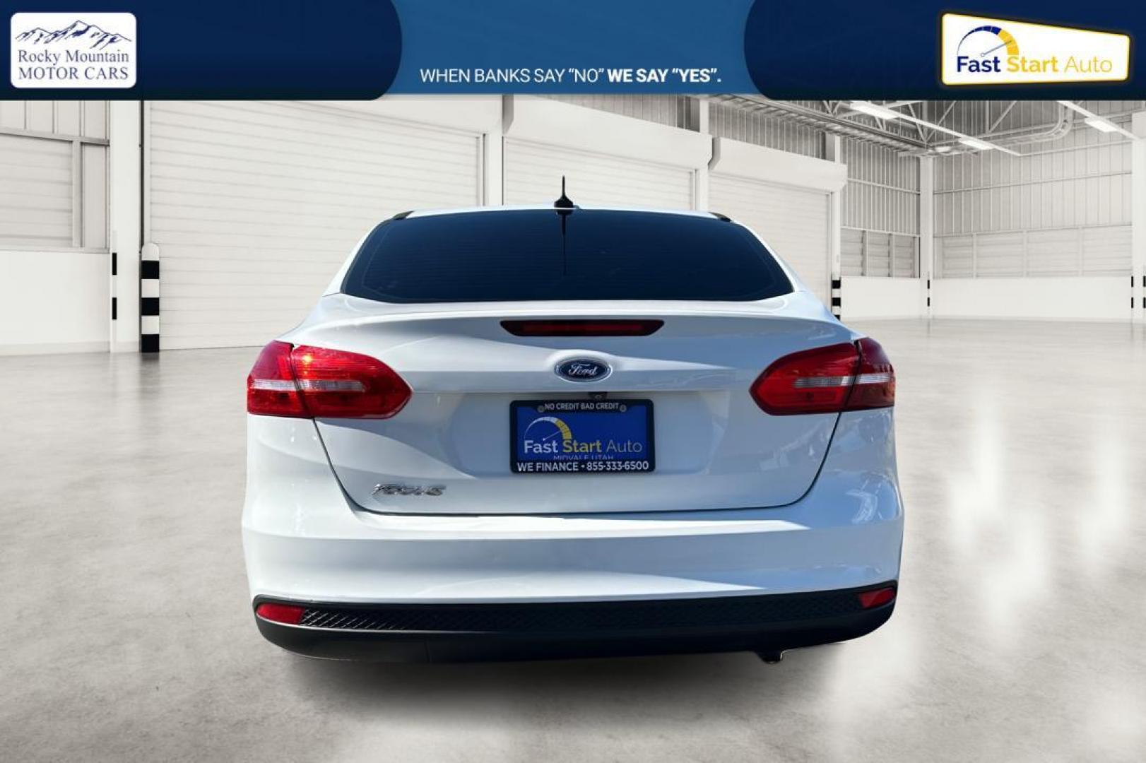 2016 White Ford Focus S Sedan (1FADP3E26GL) with an 2.0L L4 DOHC 16V engine, 5M transmission, located at 7755 State Street, Midvale, UT, 84047, (801) 753-9063, 40.610329, -111.890656 - Photo#3