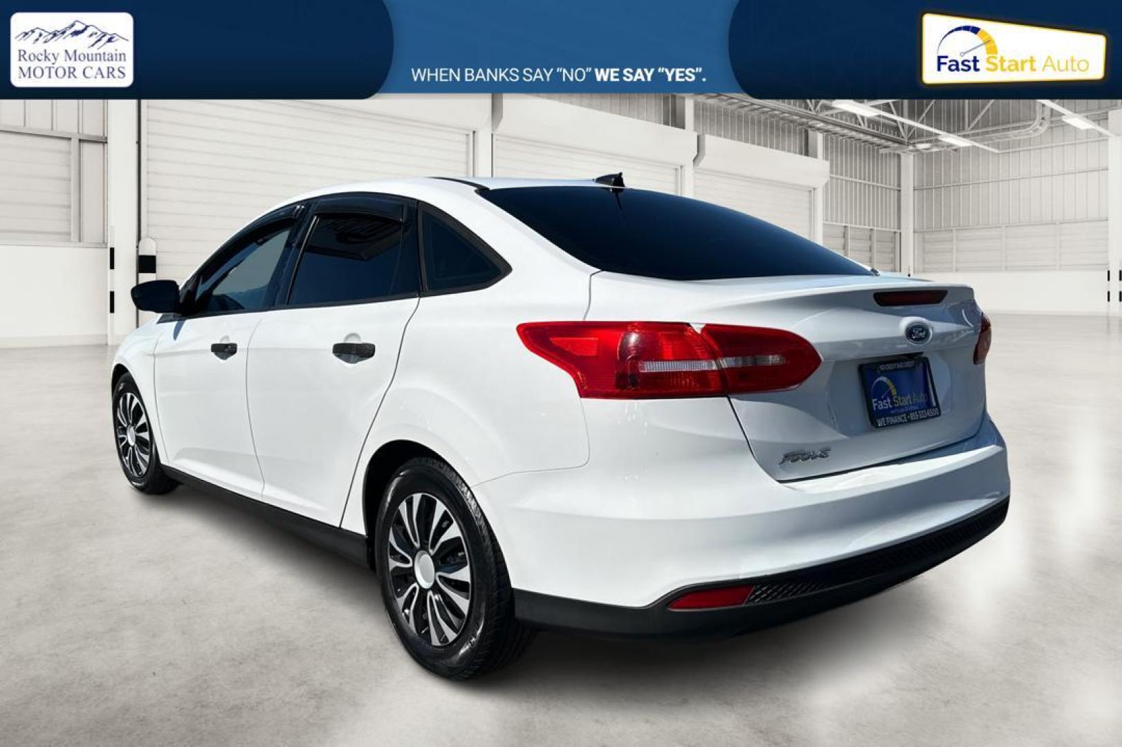 2016 White Ford Focus S Sedan (1FADP3E26GL) with an 2.0L L4 DOHC 16V engine, 5M transmission, located at 7755 State Street, Midvale, UT, 84047, (801) 753-9063, 40.610329, -111.890656 - Photo#4
