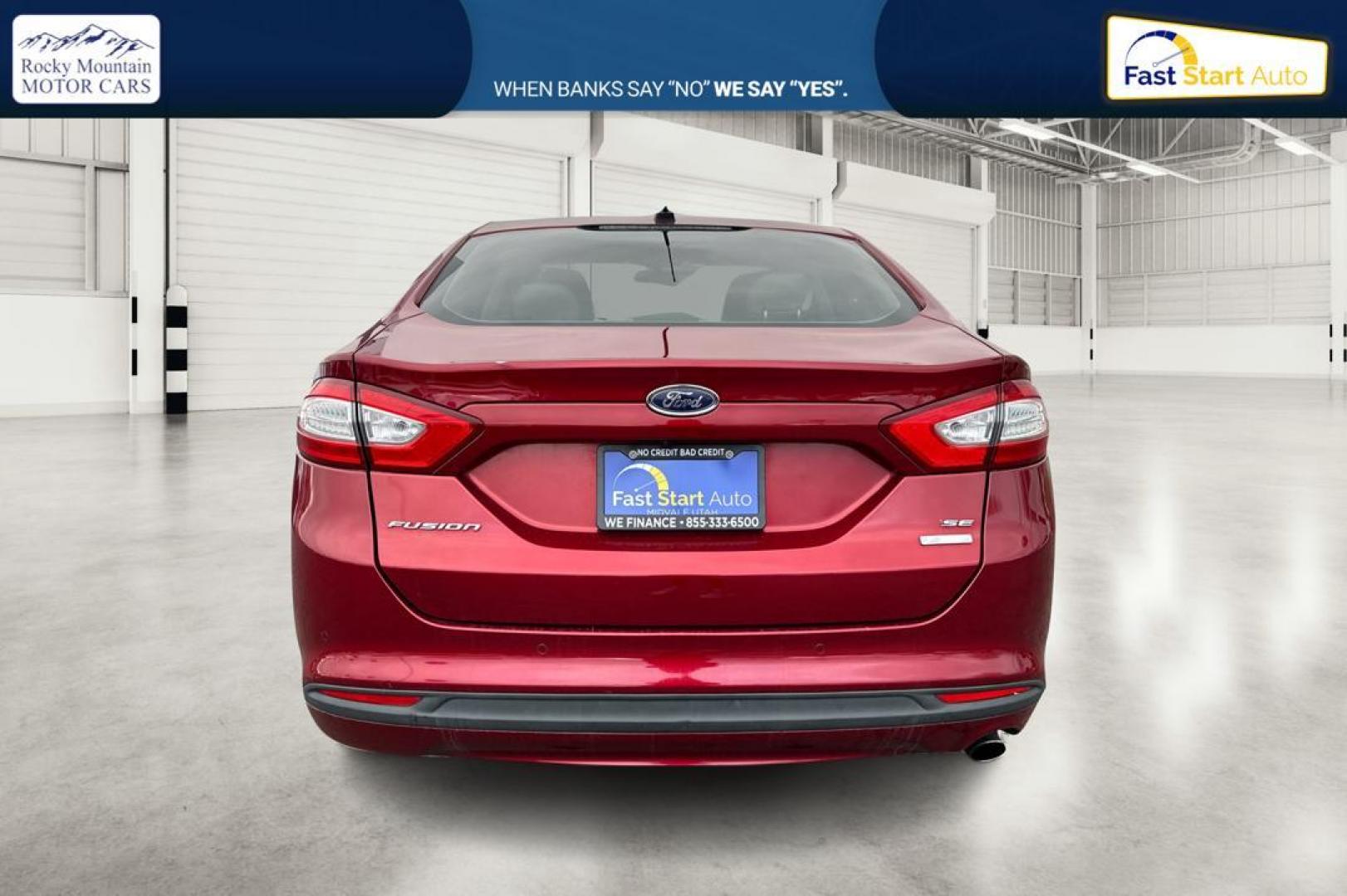2016 Red Ford Fusion SE (1FA6P0HD4G5) with an 1.5L L4 DOHC 16V engine, 6-Speed Automatic transmission, located at 7755 State Street, Midvale, UT, 84047, (801) 753-9063, 40.610329, -111.890656 - Photo#4