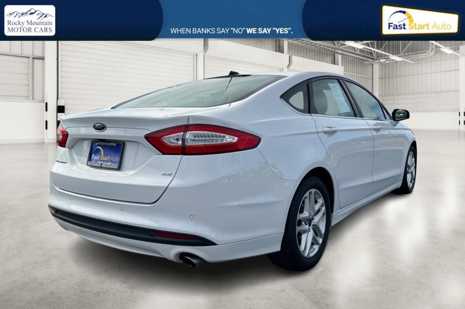 2016 White Ford Fusion SE (3FA6P0H77GR) with an 2.5L L4 DOHC 16V engine, 6-Speed Automatic transmission, located at 7755 State Street, Midvale, UT, 84047, (801) 753-9063, 40.610329, -111.890656 - Photo#2