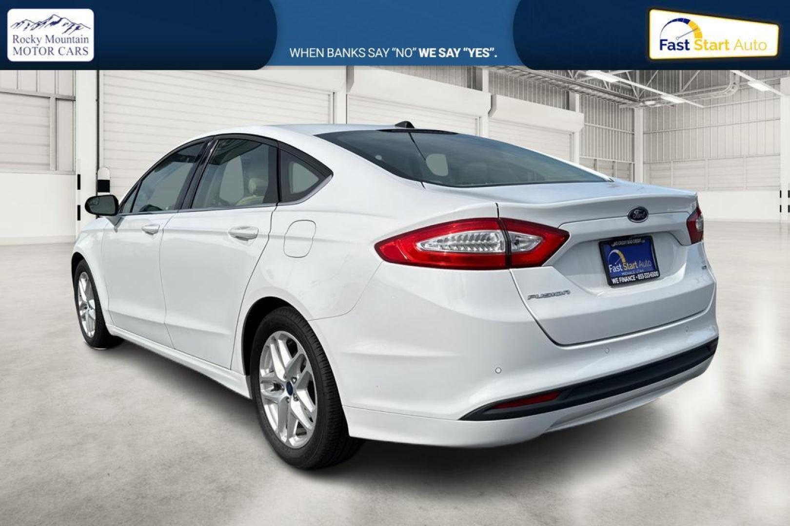 2016 White Ford Fusion SE (3FA6P0H77GR) with an 2.5L L4 DOHC 16V engine, 6-Speed Automatic transmission, located at 7755 State Street, Midvale, UT, 84047, (801) 753-9063, 40.610329, -111.890656 - Photo#5