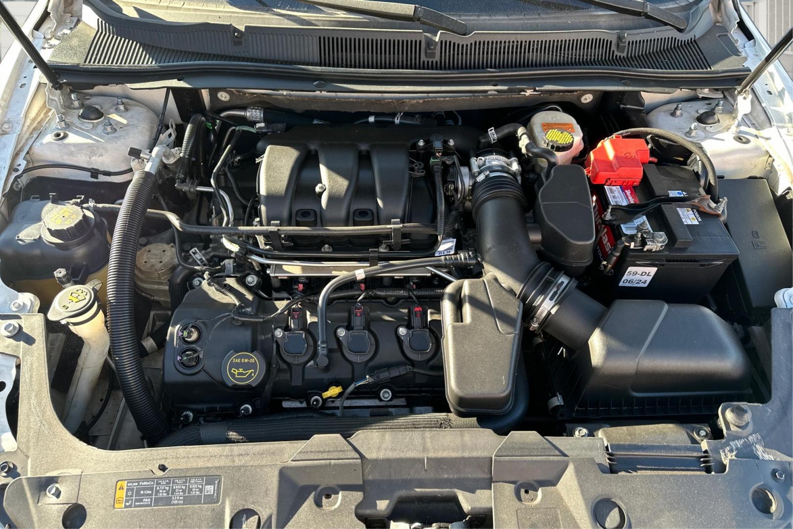 2016 White Ford Taurus SEL FWD (1FAHP2E83GG) with an 3.5L V6 DOHC 24V engine, 6A transmission, located at 7755 State Street, Midvale, UT, 84047, (801) 753-9063, 40.610329, -111.890656 - Photo#10