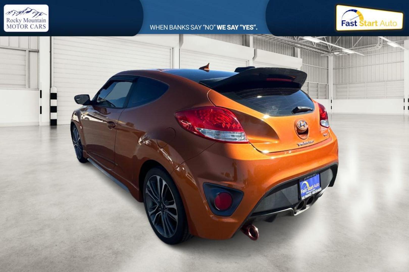 2016 Orange Hyundai Veloster Turbo 6MT (KMHTC6AE4GU) with an 1.6L L4 DOHC 16V TURBO engine, 6M transmission, located at 7755 State Street, Midvale, UT, 84047, (801) 753-9063, 40.610329, -111.890656 - Photo#5