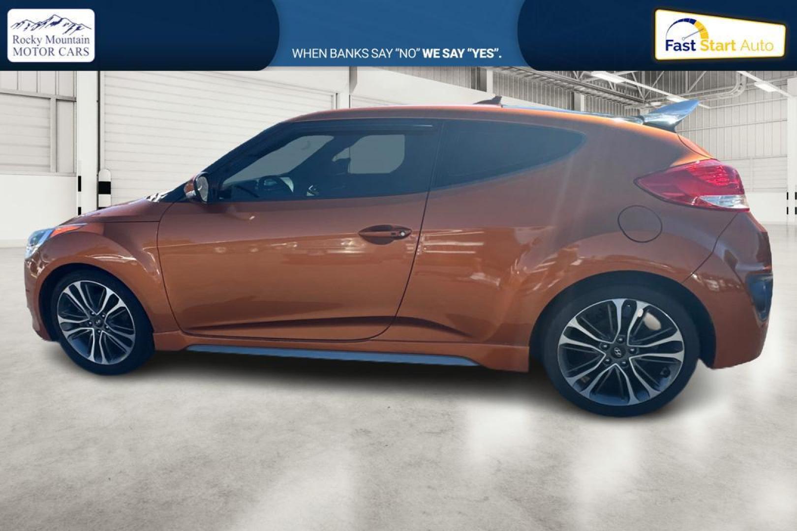 2016 Orange Hyundai Veloster Turbo 6MT (KMHTC6AE4GU) with an 1.6L L4 DOHC 16V TURBO engine, 6M transmission, located at 7755 State Street, Midvale, UT, 84047, (801) 753-9063, 40.610329, -111.890656 - Photo#6
