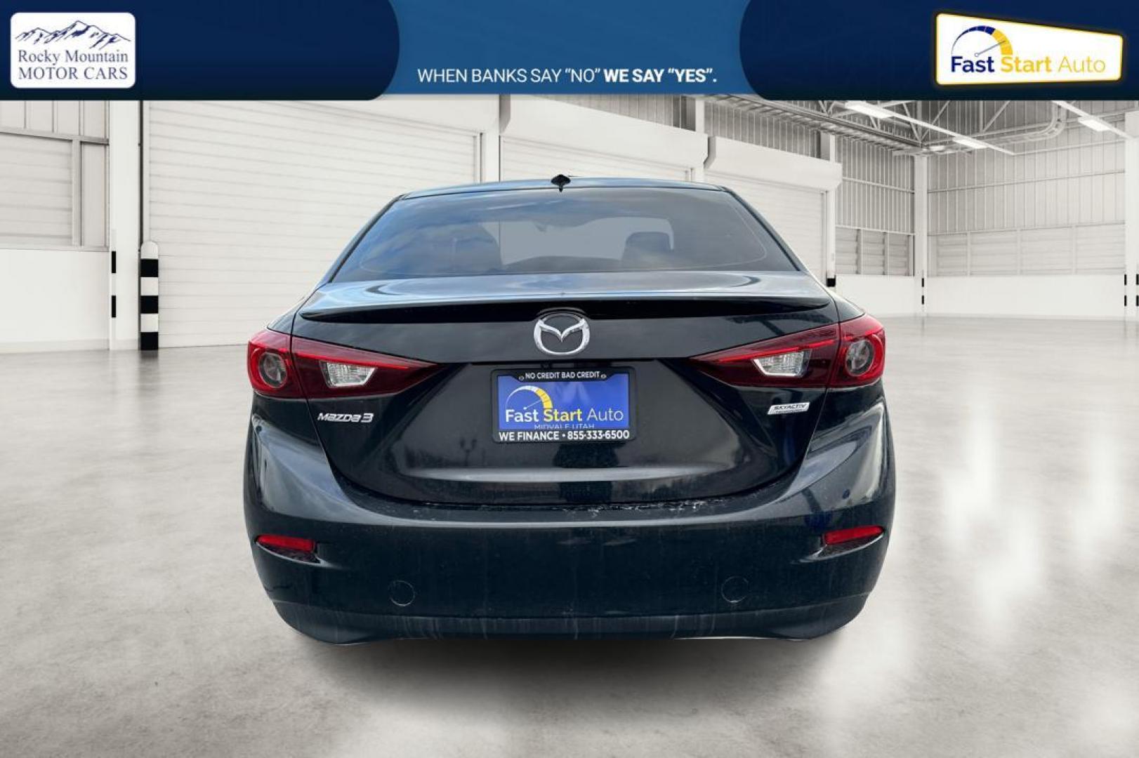2016 Black Mazda MAZDA3 i Grand Touring MT 4-Door (JM1BM1W79G1) with an 2.0L L4 DOHC 16V engine, 6M transmission, located at 7755 State Street, Midvale, UT, 84047, (801) 753-9063, 40.610329, -111.890656 - Photo#4