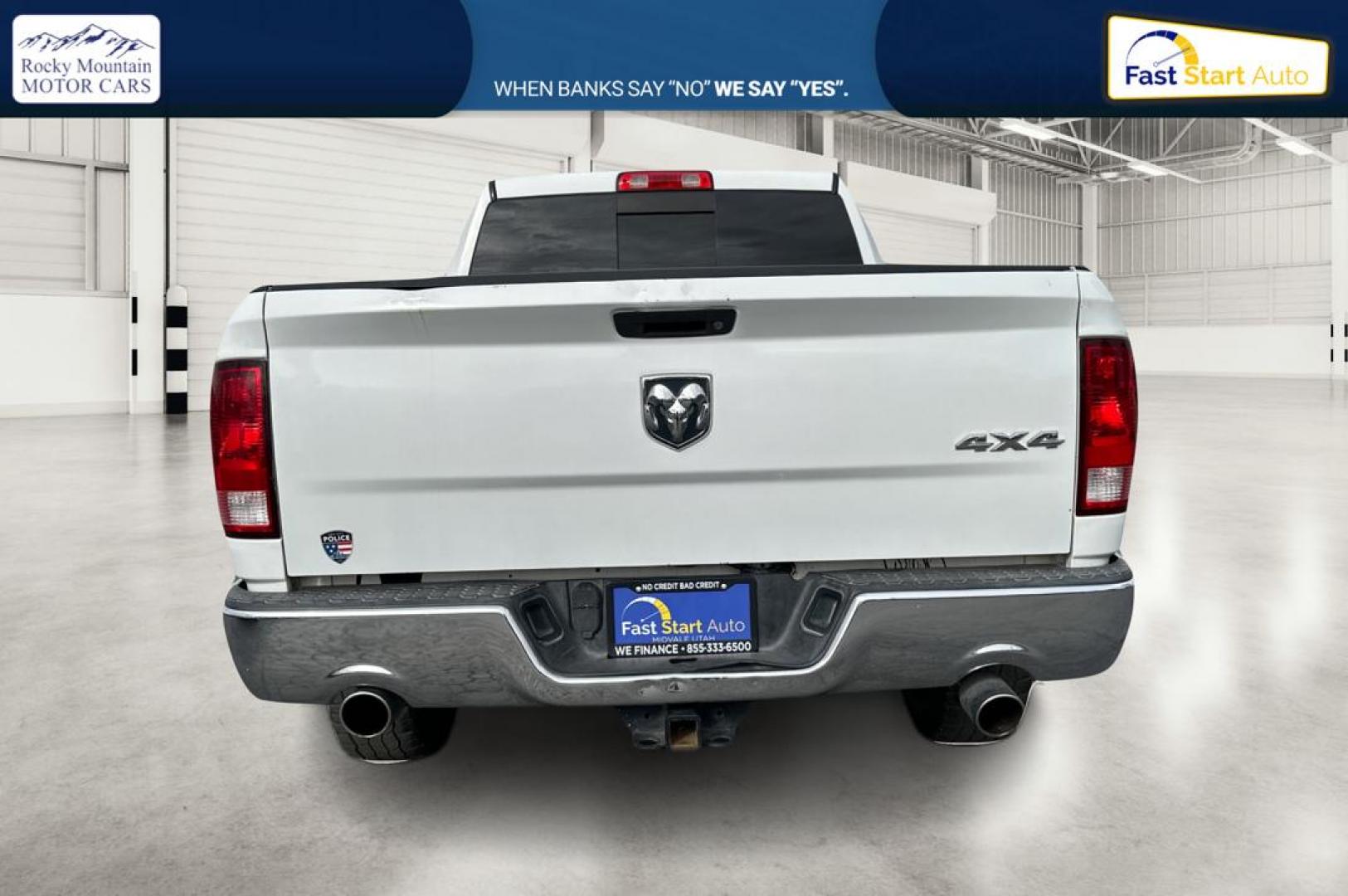2016 White RAM 1500 SLT Quad Cab 4WD (1C6RR7GTXGS) with an 5.7L V8 OHV 16V engine, 6A transmission, located at 7755 State Street, Midvale, UT, 84047, (801) 753-9063, 40.610329, -111.890656 - Photo#4