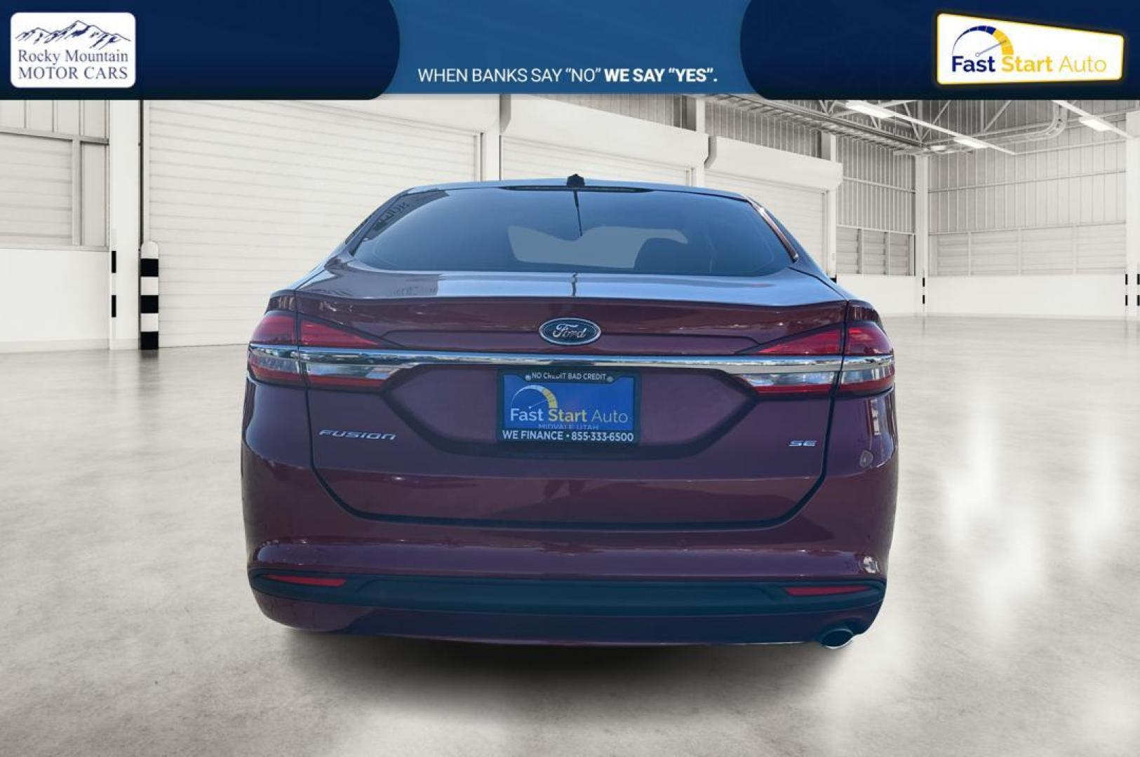 2017 Red Ford Fusion SE (3FA6P0H79HR) with an 2.5L L4 DOHC 16V engine, 6A transmission, located at 767 S State Road, Pleasant Grove, UT, 84062, (801) 785-1058, 40.354839, -111.736687 - Photo#4