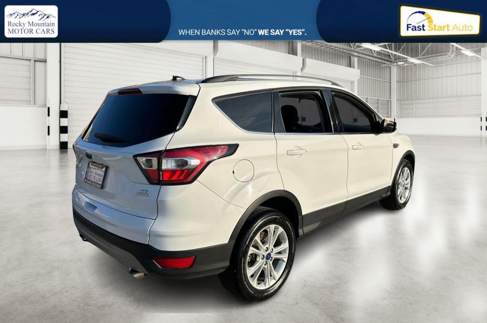 2018 White Ford Escape SE FWD (1FMCU0G92JU) with an 2.0L L4 DOHC 16V engine, 6A transmission, located at 7755 State Street, Midvale, UT, 84047, (801) 753-9063, 40.610329, -111.890656 - Photo#2