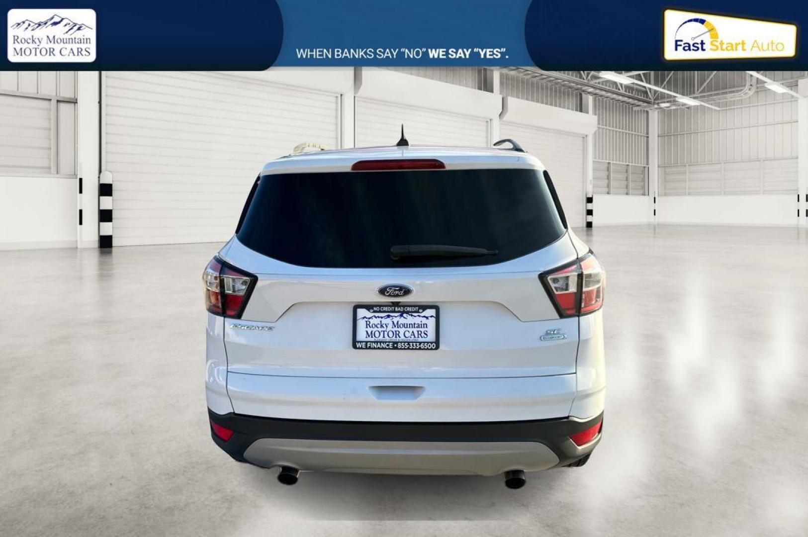 2018 White Ford Escape SE FWD (1FMCU0G92JU) with an 2.0L L4 DOHC 16V engine, 6A transmission, located at 7755 State Street, Midvale, UT, 84047, (801) 753-9063, 40.610329, -111.890656 - Photo#3