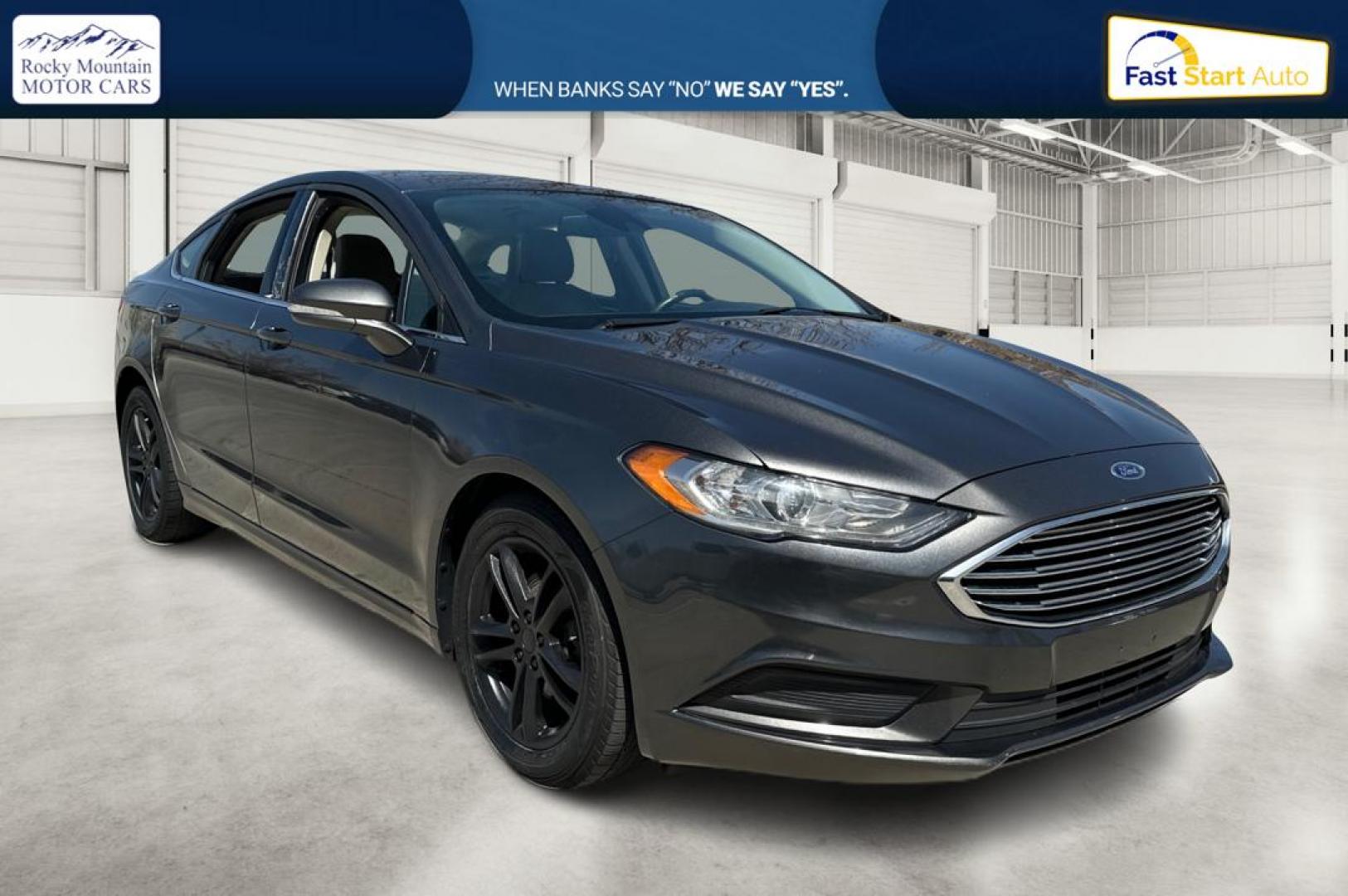 2018 Gray Ford Fusion SE (3FA6P0HD7JR) with an 1.5L L4 DOHC 16V engine, 6A transmission, located at 7755 State Street, Midvale, UT, 84047, (801) 753-9063, 40.610329, -111.890656 - Photo#0