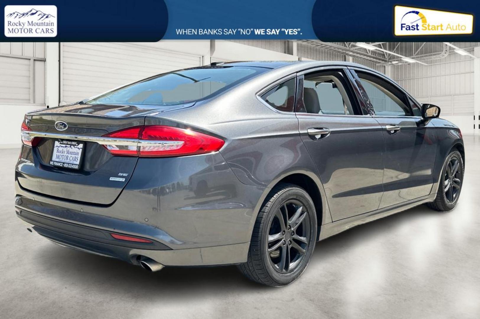 2018 Gray Ford Fusion SE (3FA6P0HD7JR) with an 1.5L L4 DOHC 16V engine, 6A transmission, located at 7755 State Street, Midvale, UT, 84047, (801) 753-9063, 40.610329, -111.890656 - Photo#2