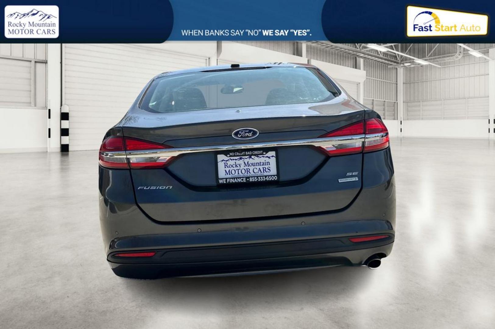 2018 Gray Ford Fusion SE (3FA6P0HD7JR) with an 1.5L L4 DOHC 16V engine, 6A transmission, located at 7755 State Street, Midvale, UT, 84047, (801) 753-9063, 40.610329, -111.890656 - Photo#4