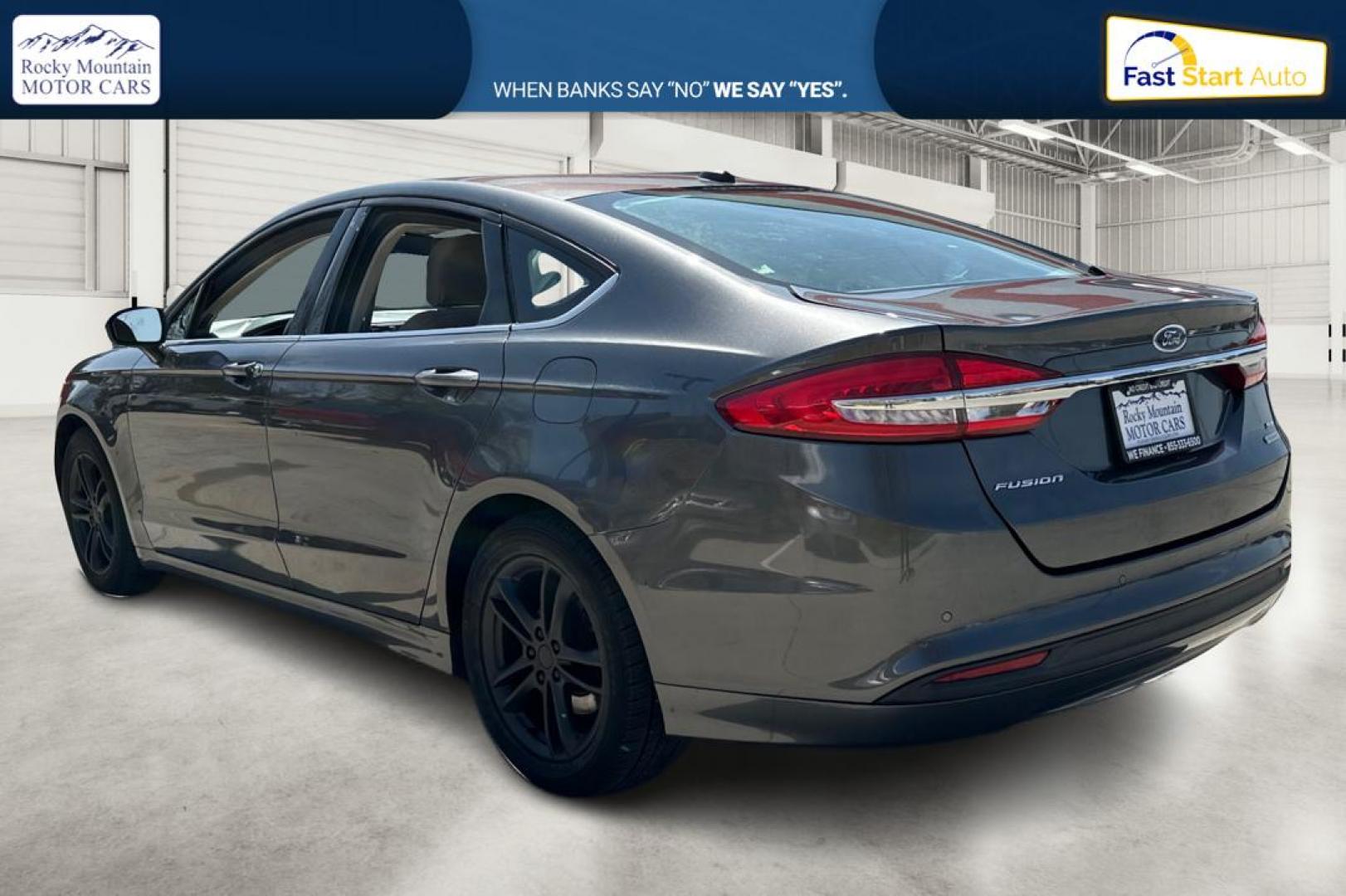 2018 Gray Ford Fusion SE (3FA6P0HD7JR) with an 1.5L L4 DOHC 16V engine, 6A transmission, located at 7755 State Street, Midvale, UT, 84047, (801) 753-9063, 40.610329, -111.890656 - Photo#5