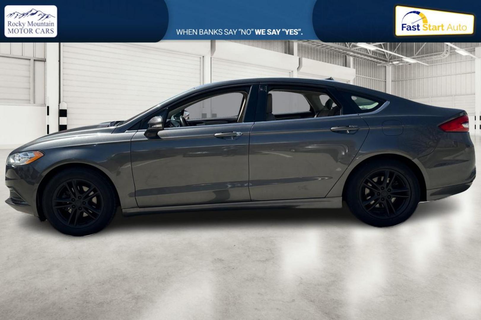 2018 Gray Ford Fusion SE (3FA6P0HD7JR) with an 1.5L L4 DOHC 16V engine, 6A transmission, located at 7755 State Street, Midvale, UT, 84047, (801) 753-9063, 40.610329, -111.890656 - Photo#6