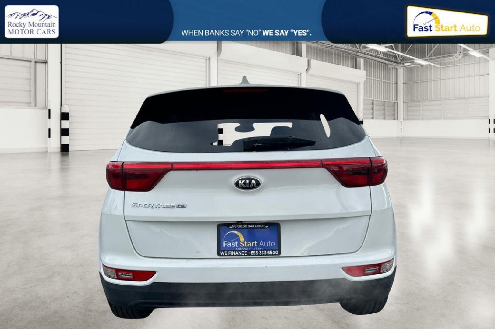 2018 White Kia Sportage LX FWD (KNDPM3AC7J7) with an 2.4L V6 DOHC 24V engine, 6A transmission, located at 7755 State Street, Midvale, UT, 84047, (801) 753-9063, 40.610329, -111.890656 - Photo#4
