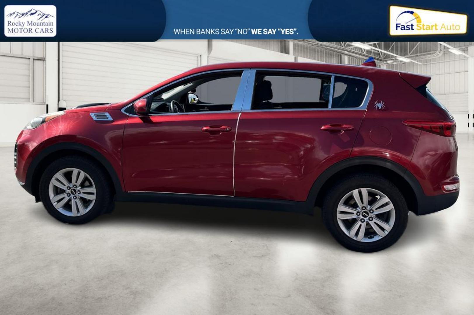 2018 Red Kia Sportage LX AWD (KNDPMCACXJ7) with an 2.4L V6 DOHC 24V engine, 6A transmission, located at 767 S State Road, Pleasant Grove, UT, 84062, (801) 785-1058, 40.354839, -111.736687 - Photo#5