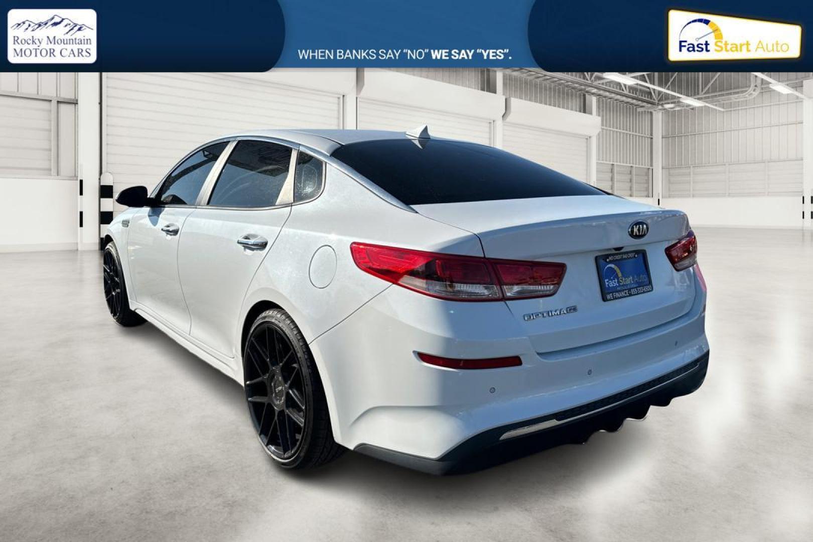 2019 White Kia Optima LX (5XXGT4L35KG) with an 2.4L L4 DOHC 16V engine, 6A transmission, located at 7755 State Street, Midvale, UT, 84047, (801) 753-9063, 40.610329, -111.890656 - Photo#5